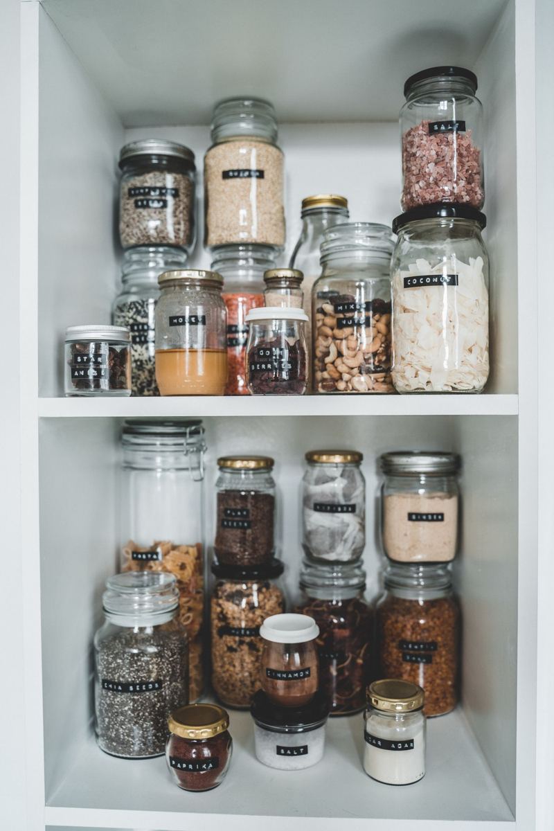 Pantry shelves with labeled glass jars